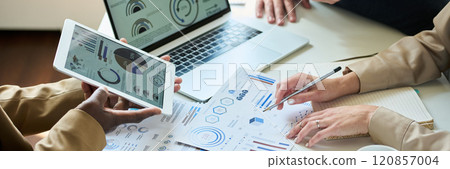 Discussing financial charts at meeting 120857004