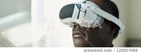 Watching presentation in VR headset 120857008