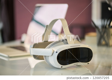 Virtual reality headset on workplace 120857205