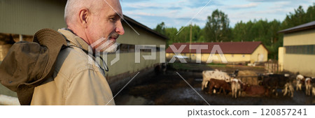Bearded owner of modern livestock farm 120857241