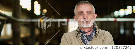 Farmer in grey shirt looking at camera 120857242
