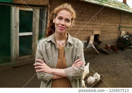 Happy young female farmer in grey shirt Happy young female farmer in grey shirt 120857513
