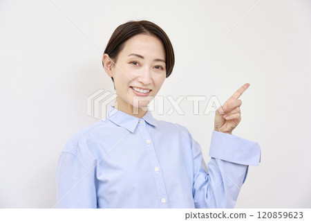 Woman pointing to the right on white background Woman pointing to the right on white background 120859623