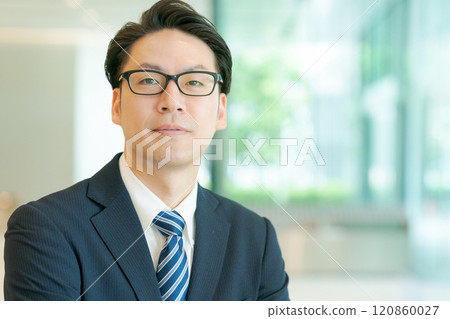 smiling man in suit 120860027