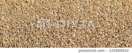 Background of sand, small pebbles and flowing wave on the sea beach. Summer vacation and coastal nature concept 120860042