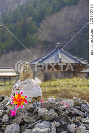 Scenery of sacred mountain Osorezan: Buddha statue and windmill 120860759