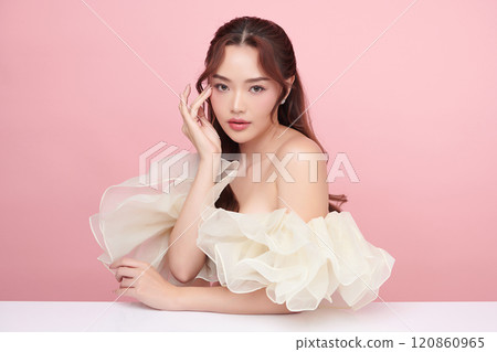 Beautiful young asian woman with clean fresh skin on pink background, Face care, Facial treatment, Cosmetology, beauty and spa, Asian women portrait. Beautiful young asian woman with clean fresh skin on pink background, Face care, Facial treatment, Cosmetology, beauty and spa, Asian women portrait. 120860965