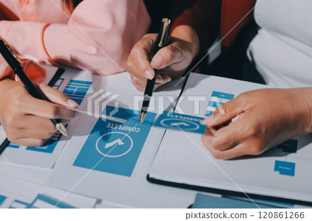 Young Asian business creative team work together, mobile application software design project. Brainstorm meeting, internet technology, smartphone web app designer, office coworker teamwork concept Young Asian business creative team work together, mobile application software design project. Brainstorm meeting, internet technology, smartphone web app designer, office coworker teamwork concept 120861266