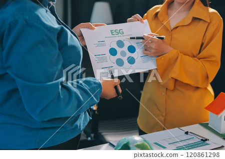 ESG environmental social governance display on laptop on eco-friendly company meeting with business people implementing environmental protection for clean and sustainable future ecology. Trailblazing 120861298