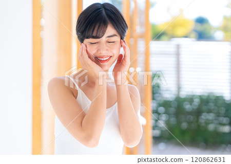 Young woman doing skin care at home 120862631