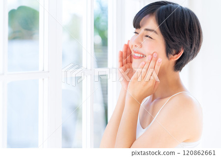 Young woman doing skin care at home Young woman doing skin care at home 120862661