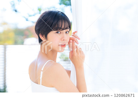Young woman doing skin care at home Young woman doing skin care at home 120862671