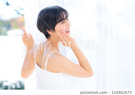 Young woman doing skin care at home 120862673