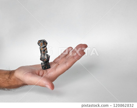 Hand balancing stacked dice: precision and skill in tabletop gaming 120862832