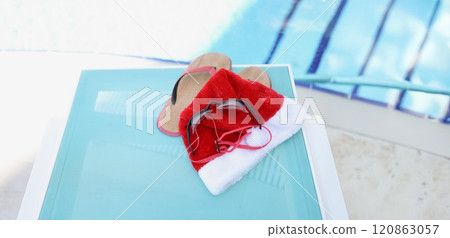 Santa Claus hat and accessories for swimming in the pool Santa Claus hat and accessories for swimming in the pool 120863057