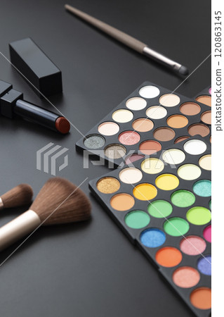 Eyeshadow palette and lipstick on a white background Eyeshadow palette and lipstick on a white background 120863145