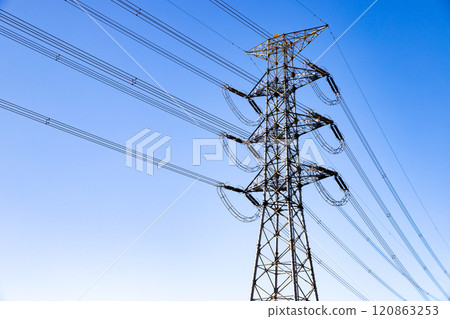 Power line tower and clear blue sky 120863253