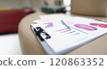 A folder with documents lies on a leather surface 120863352