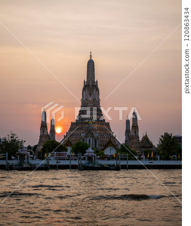 Pagoda at Wat Arun, a royal temple at Chaopraya river on sunset time, Bangkok, Thailand. 120863434