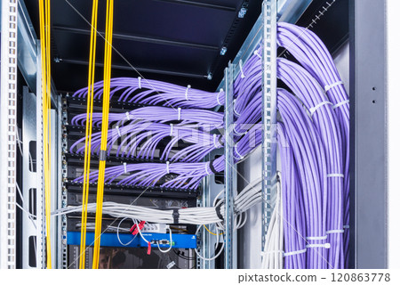 network cables connected into server inside data center 120863778