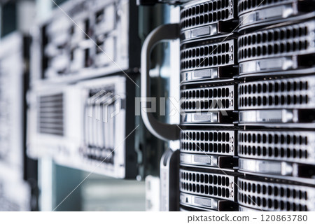 Cluster of data storage hard drives inside server room 120863780