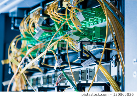 detail of server rack with fiber optic cables attached to front 120863826