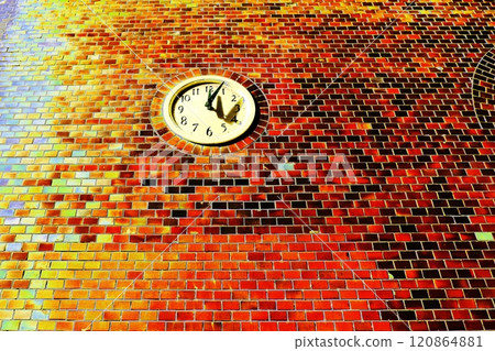 Analog clock set into a brick wall Analog clock set into a brick wall 120864881