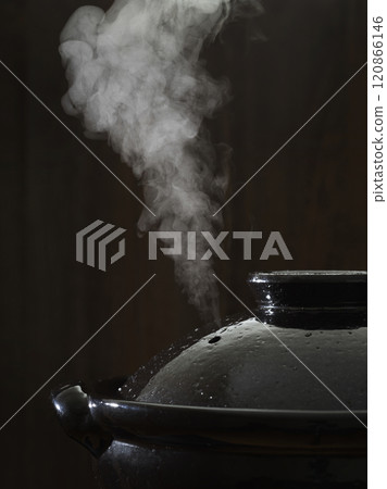 Image of hot pot cooking with steam rising from the clay pot 120866146