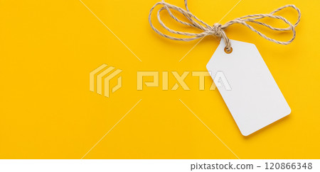 Blanc white tag on a vibrant yellow background for labeling gifts 120866348