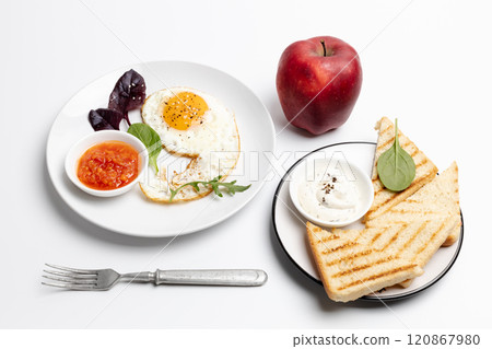 Fried egg on the plate, grilled toasts and an apple, Fried egg on the plate, grilled toasts and an apple, 120867980