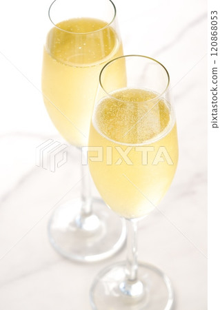 Stock footage of a toast being made by pouring chilled champagne (sparkling wine) into two flute glasses Stock footage of a toast being made by pouring chilled champagne (sparkling wine) into two flute glasses 120868053