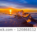 Frosty air and frozen lake surface in a beautiful sunset landscape. Beautiful ice shapes and sunlight. Photo from Sotkamo, Finland. 120868112