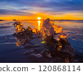 Frosty air and frozen lake surface in a beautiful sunset landscape. Beautiful ice shapes and sunlight. Photo from Sotkamo, Finland. 120868114