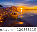 Frosty air and frozen lake surface in a beautiful sunset landscape. Beautiful ice shapes and sunlight. Photo from Sotkamo, Finland. 120868115