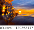 Frosty air and frozen lake surface in a beautiful sunset landscape. Beautiful ice shapes and sunlight. Photo from Sotkamo, Finland. 120868117