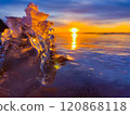 Frosty air and frozen lake surface in a beautiful sunset landscape. Beautiful ice shapes and sunlight. Photo from Sotkamo, Finland. 120868118