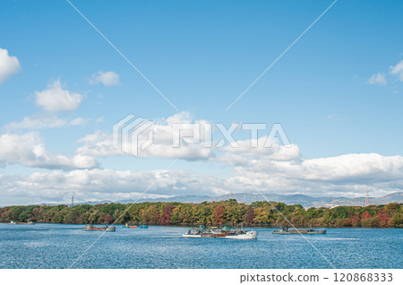 A work boat collecting gravel in the Yodo River, Hirakata City 120868333