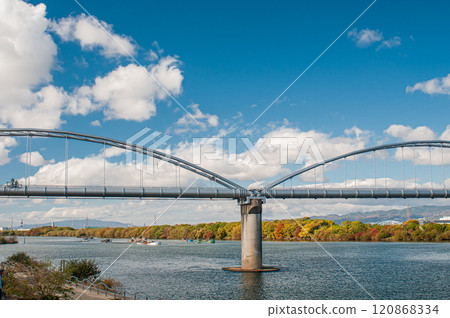 Water pipe bridge over the Yodo River and a gravel mining ship, Hirakata City Water pipe bridge over the Yodo River and a gravel mining ship, Hirakata City 120868334