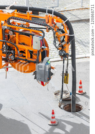 Pipe hose sewage truck car engine emptying city street sewerage manhole. Septic cleaning vacuum service maintenance technology equipment industry. Suction vehicle cleaner machine pumping drainage Pipe hose sewage truck car engine emptying city street sewerage manhole. Septic cleaning vacuum service maintenance technology equipment industry. Suction vehicle cleaner machine pumping drainage 120868711