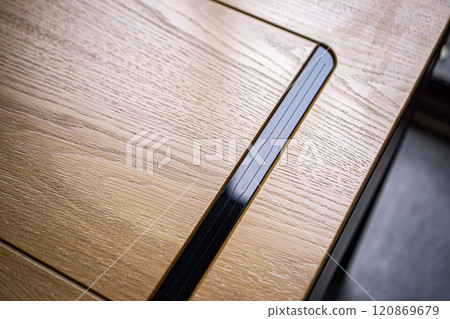 Empty rough wooden table top in the dark room 120869679