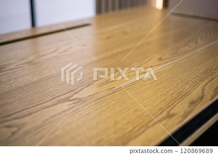 Empty rough wooden table top in the dark room Empty rough wooden table top in the dark room 120869689