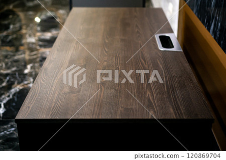 Empty rough wooden table top in the dark room 120869704