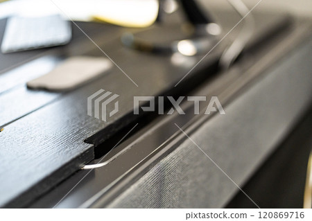 Mobile phone with wireless charger on table. Modern workplace accessory Mobile phone with wireless charger on table. Modern workplace accessory 120869716