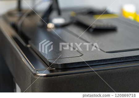 Mobile phone with wireless charger on table. Modern workplace accessory 120869718