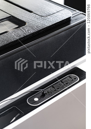 Mobile phone with wireless charger on table. Modern workplace accessory Mobile phone with wireless charger on table. Modern workplace accessory 120869766