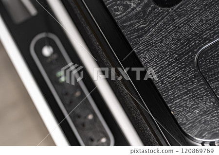 Mobile phone with wireless charger on table. Modern workplace accessory 120869769