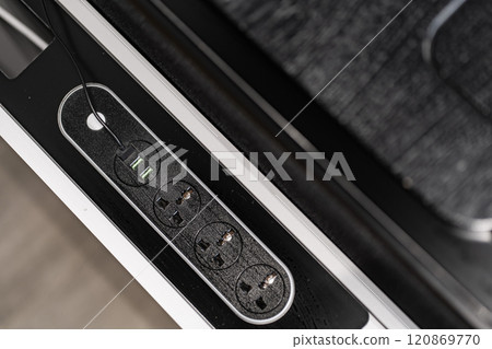 Mobile phone with wireless charger on table. Modern workplace accessory Mobile phone with wireless charger on table. Modern workplace accessory 120869770