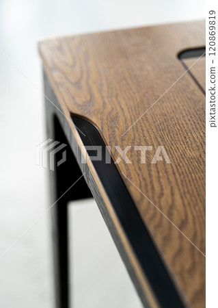 Mobile phone with wireless charger on table. Modern workplace accessory Mobile phone with wireless charger on table. Modern workplace accessory 120869819