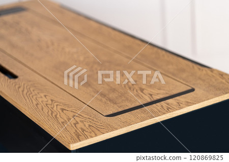 Mobile phone with wireless charger on table. Modern workplace accessory 120869825