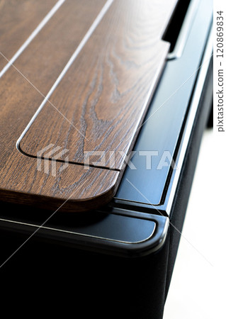 Mobile phone with wireless charger on table. Modern workplace accessory 120869834